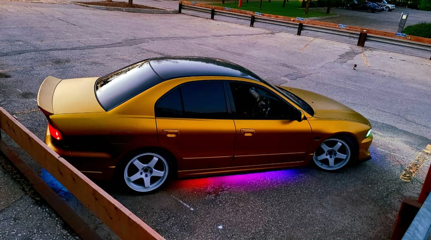 Gold custom sedan with underglow
